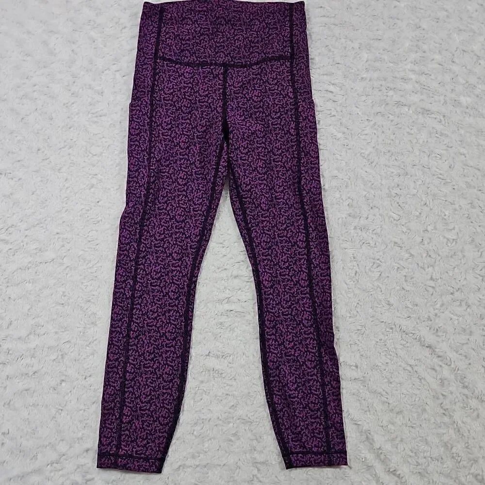 Athleta salutation stash pocket II purple and black printed 7/8 tight womens XS